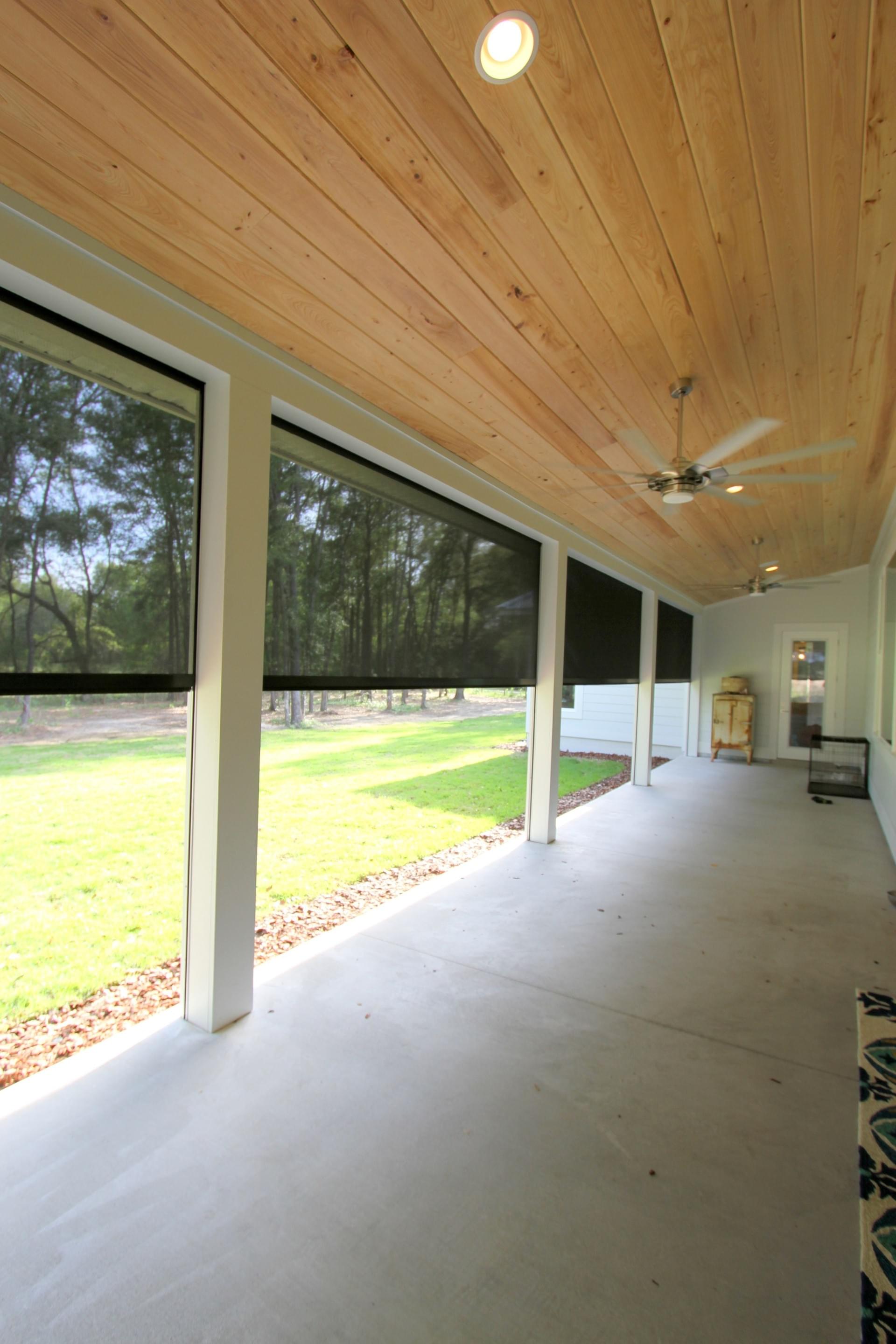 Farmhouse porch with motorized screens