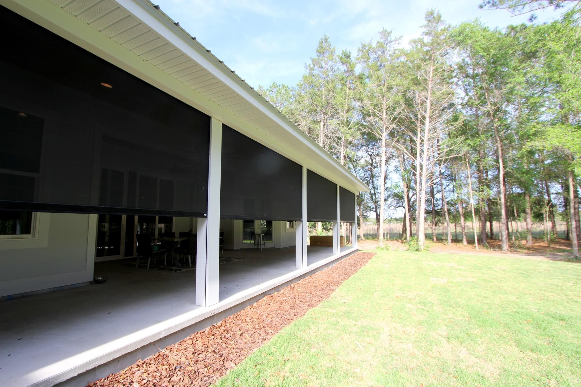 Farmhouse exterior with screen system